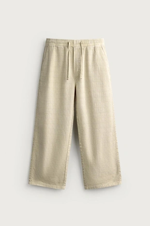 Брюки Relaxed Fit из жаккарда с эффектом потертости- Заказать в России