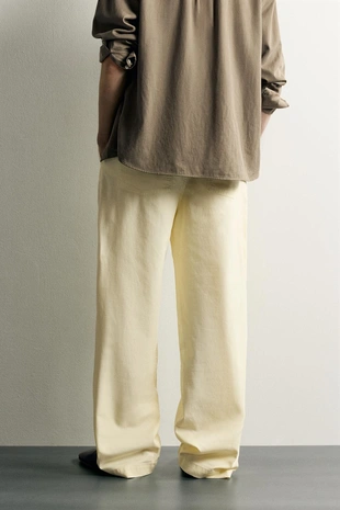 Брюки Relaxed Fit со складками и ремнем