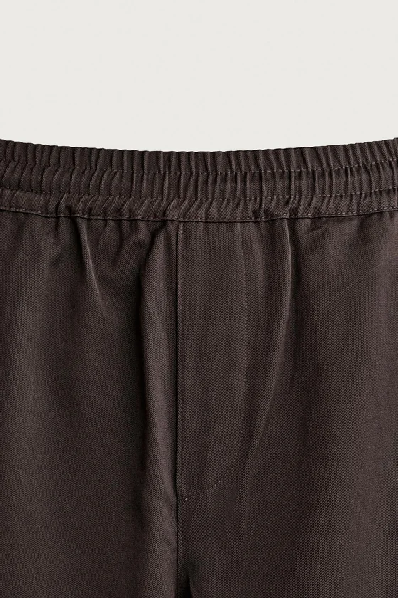 БРЮКИ BALLOON FIT С БОКОВЫМИ ЗАЩИПАМИ