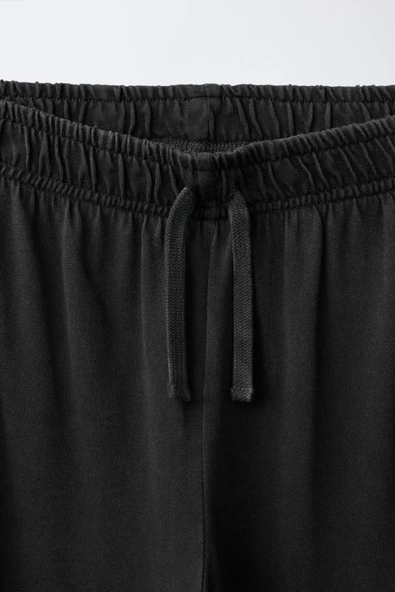 БРЮКИ WIDE LEG С ЭФФЕКТОМ ПОТЕРТОСТИ И ПРИНТОМ ЗВЕЗД