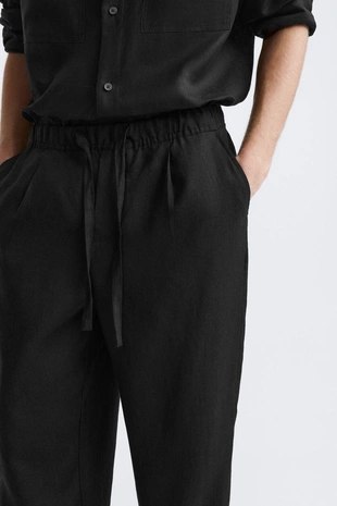 Брюки-джоггеры из 100% льна- Заказать в России