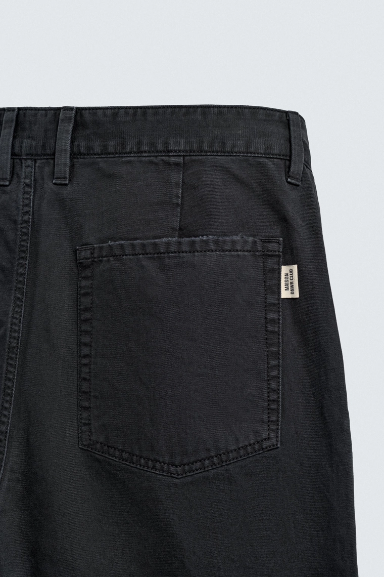 Джинсы морковного кроя с эффектом потертости