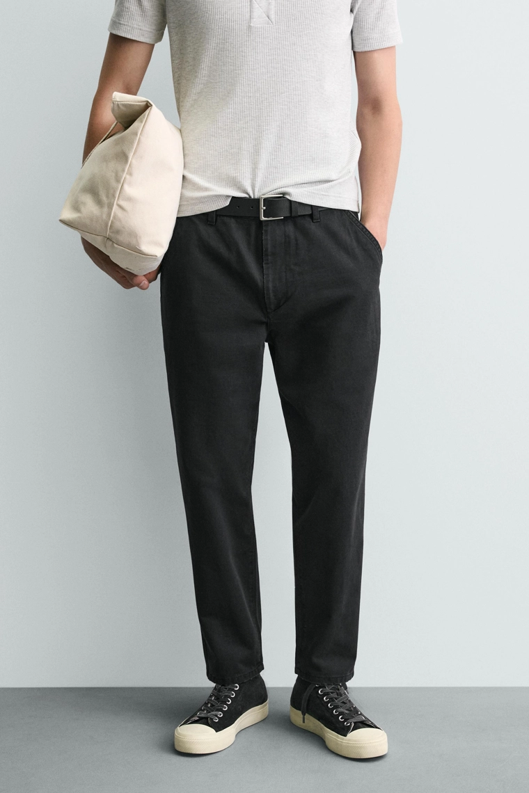 Джинсы морковного кроя с эффектом потертости