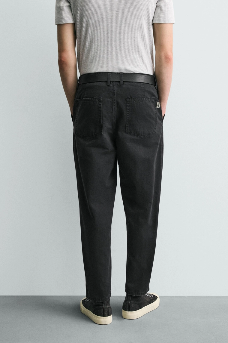 Джинсы морковного кроя с эффектом потертости