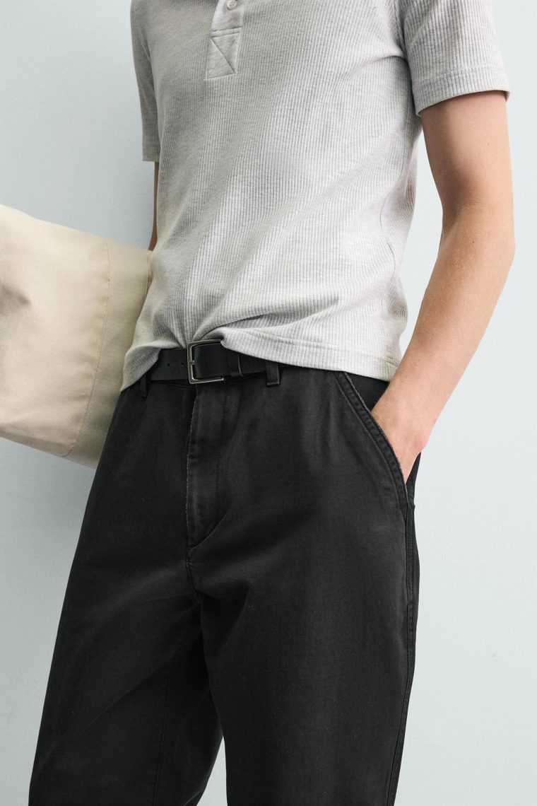 Джинсы морковного кроя с эффектом потертости