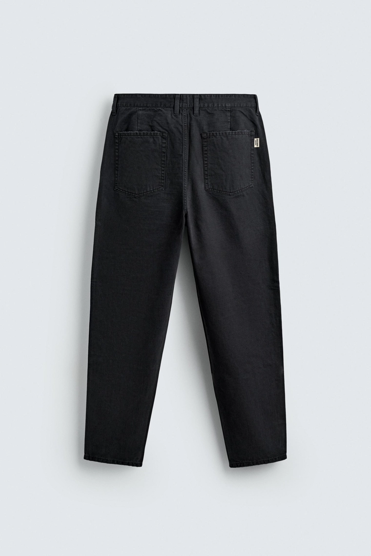 Джинсы морковного кроя с эффектом потертости