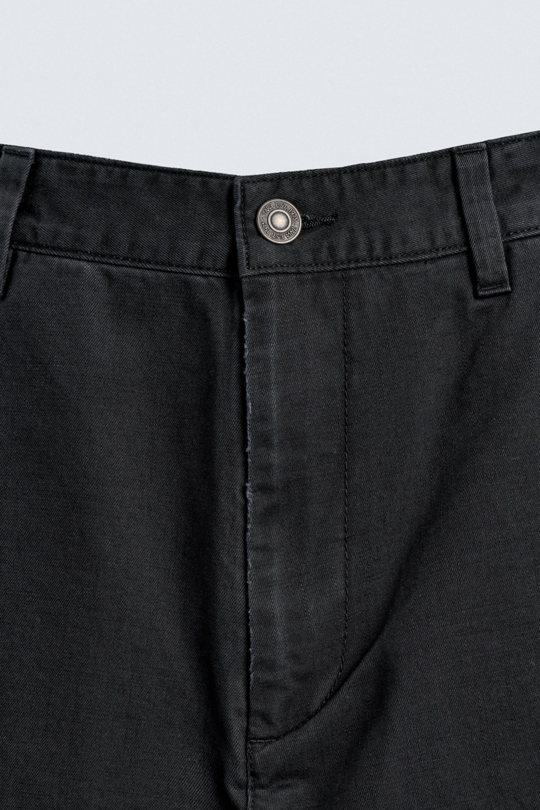 Джинсы морковного кроя с эффектом потертости