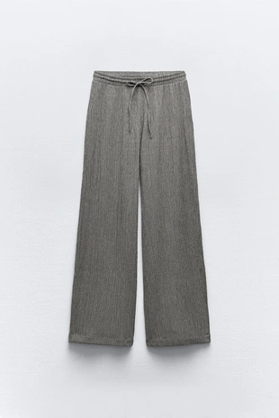 Брюки объемного кроя из рельефной ткани- Заказать в России