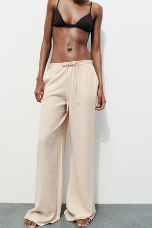 Брюки из ткани с рельефным узором- Заказать в России