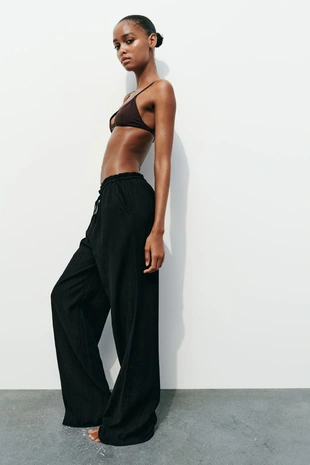 Брюки из ткани с рельефным узором- Заказать в России