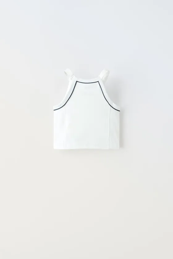 ТОП ИЗ ВЫСОКОТЕХНОЛОГИЧНОЙ ТКАНИ С КОНТРАСТНОЙ ОКАНТОВКОЙ