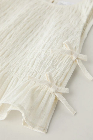 Топ с эластичной деталью и бантами- Заказать в России