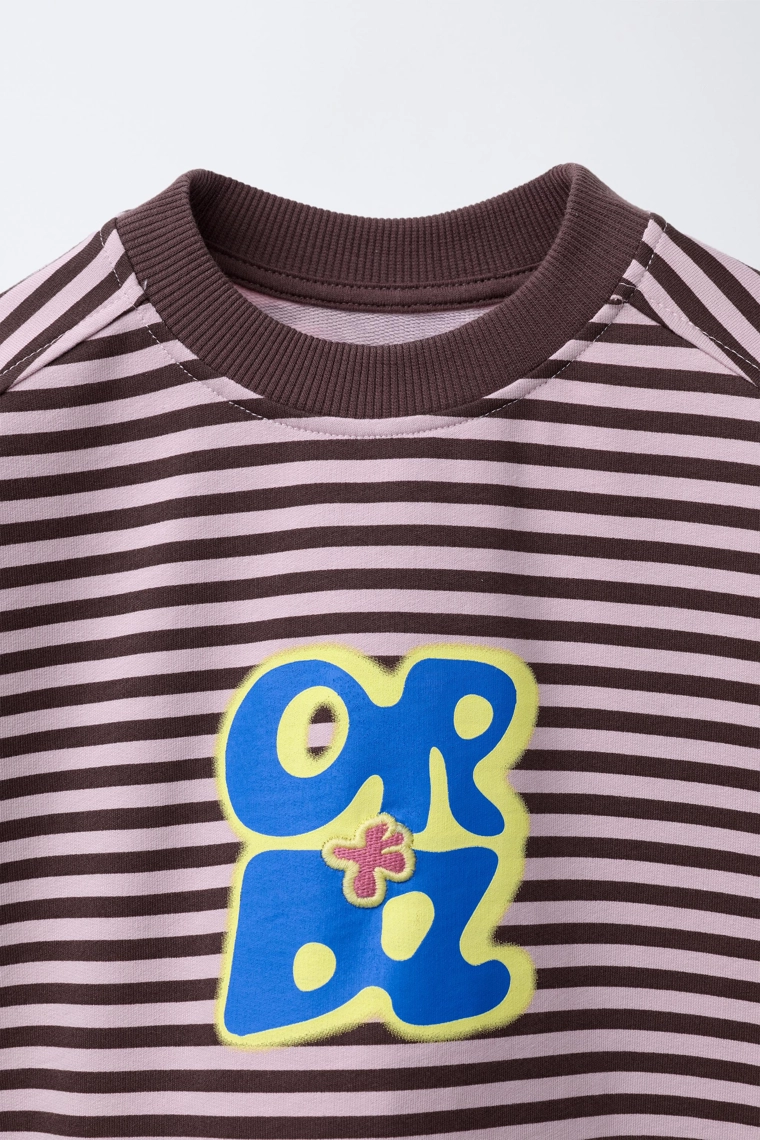 Футболка в полоску с вышитым лозунгом