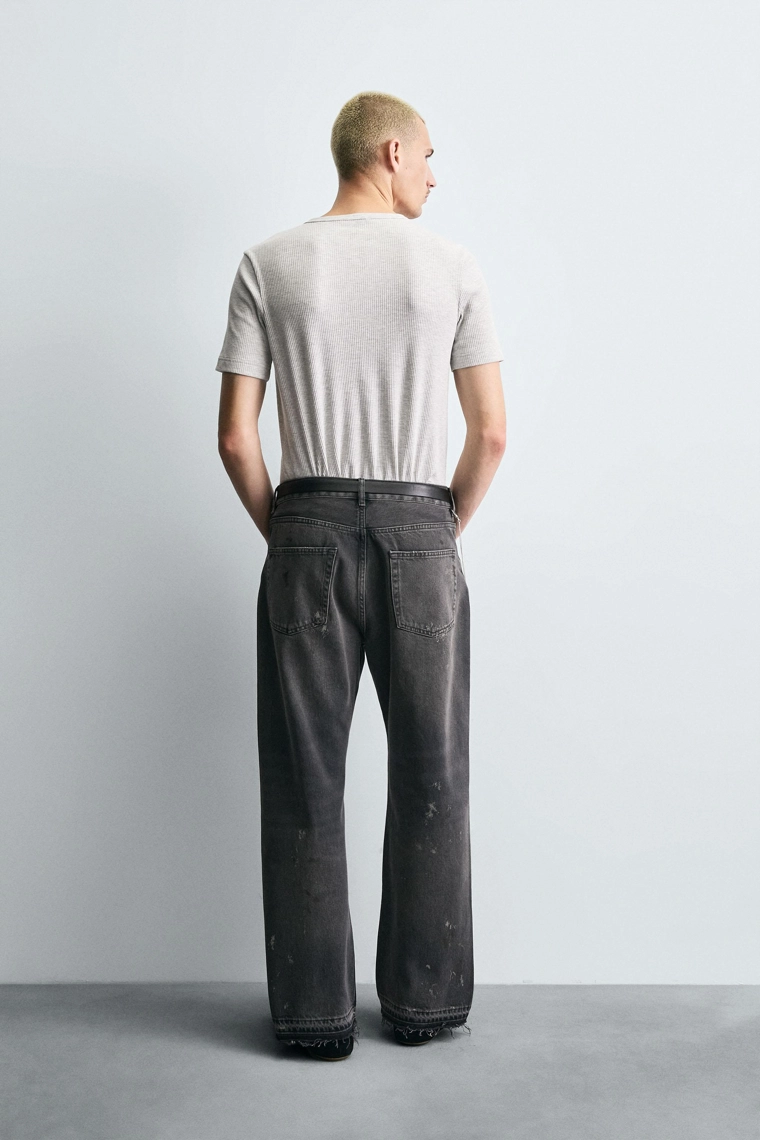 Джинсы свободного кроя с брызгами краски