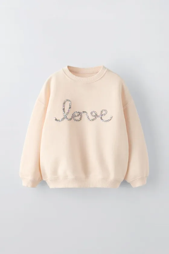 ТОЛСТОВКА С ЦВЕТОЧНЫМ ПРИНТОМ LOVE