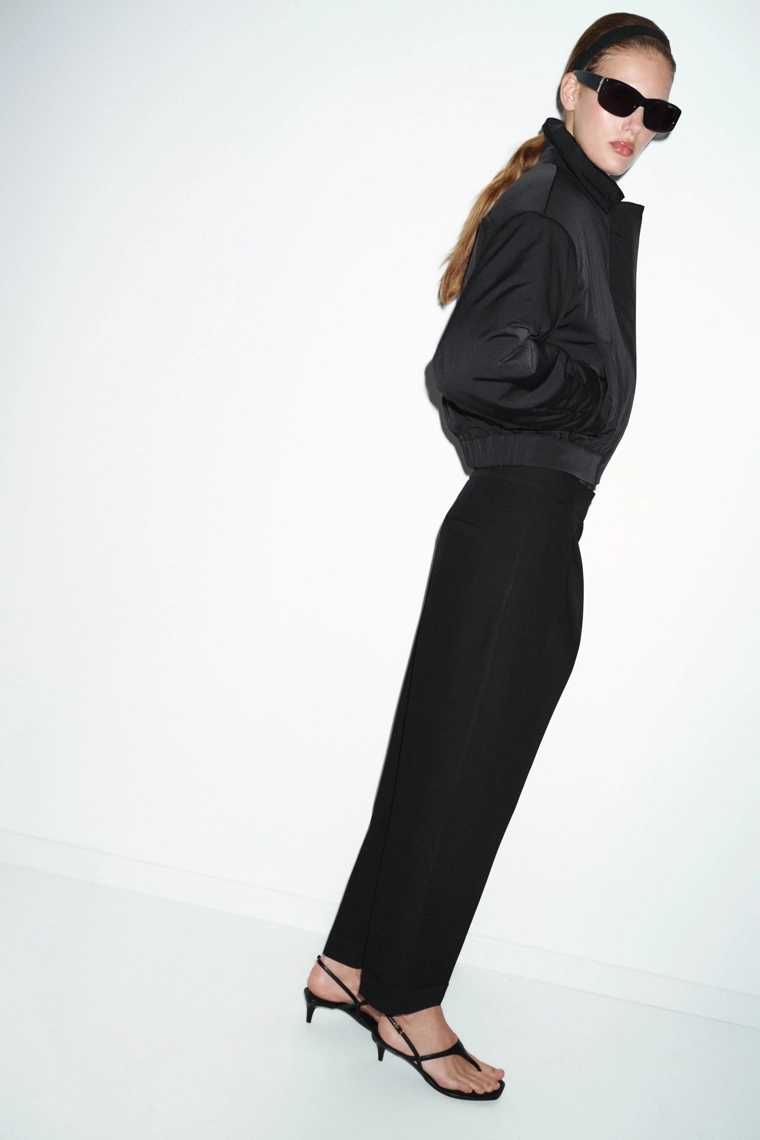 Штаны с защипами и отворотами